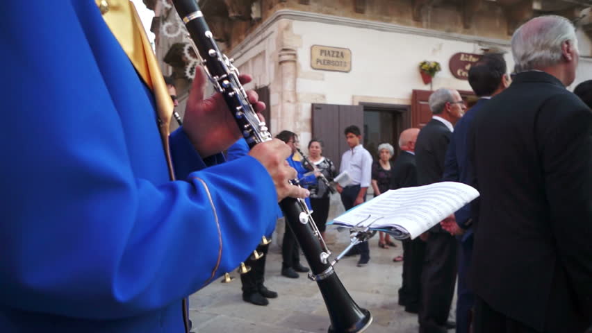 MARTINA FRANCA, ITALY - AUGUST 15: The marching band escorts the traditional Procession of Our Lady of the Assumption, followed by the Christian population parading through the city streets on August 15, 2012 in Martina Franca, Italy.