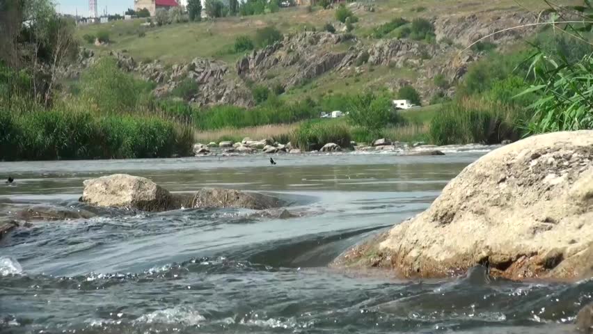 Water flowing over boulders