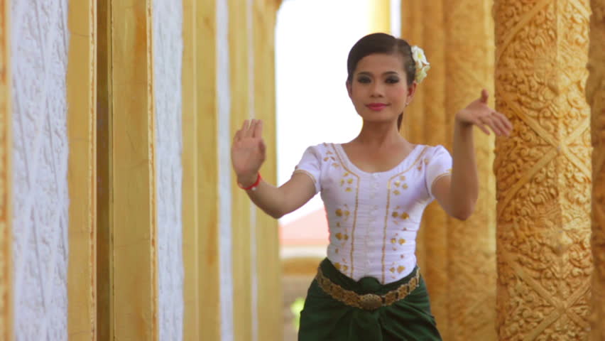 Beautiful Asian Girl performs Cambodian folk dance in temple