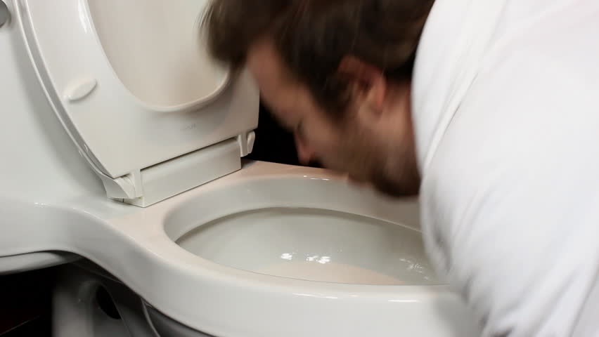 Man throws up in the toilet