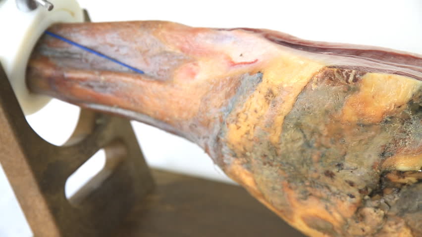 Side view of serrano ham over wood
