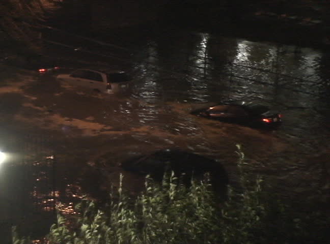 Powerful water stream goes from ocean along the West 36 street in Brooklyn New York