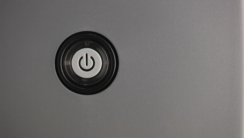 Press power button. Male index finger turning on a power button.
