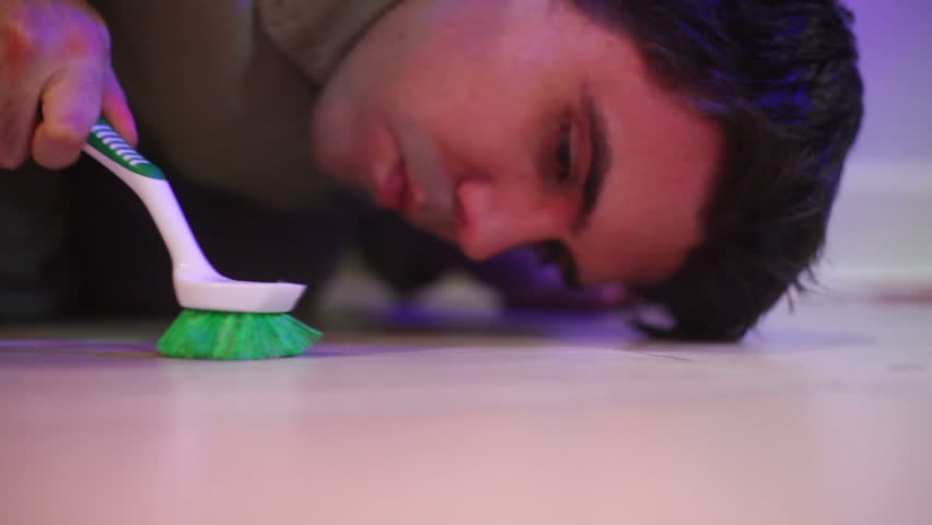 scrubbing or cleaning the floor