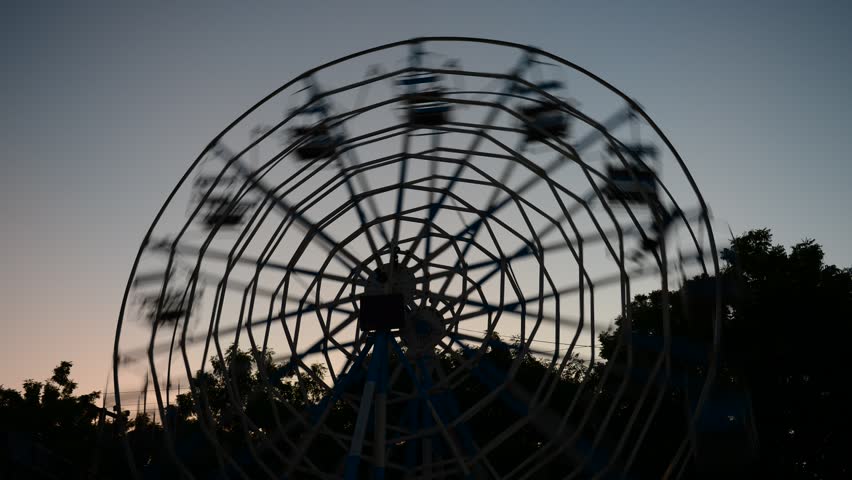 BAGAN, MYANMAR - OCTOBER 20: Time lapse of man-powered ferris wheel during âfestival of lightsâ, at Aye Nyein Tharyar Park, Bagan on October 20, 2012 in Bagan, Myanmar
