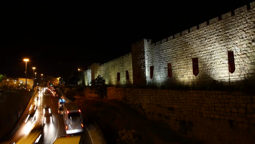 JERUSALEM, ISRAEL - NOVEMBER 01: Drivers, commuters and tourists hurry to their destinations during rush hour near the wall of Jerusalem, time lapse view, Israel, 01 November 2012