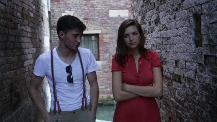 Young girl and boy walking in the narrow streets of Venice