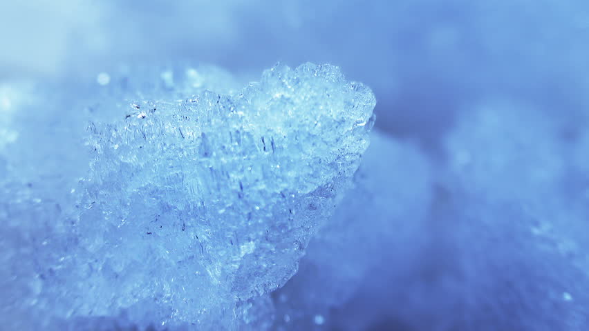 thawing blue ice close-up timelapse