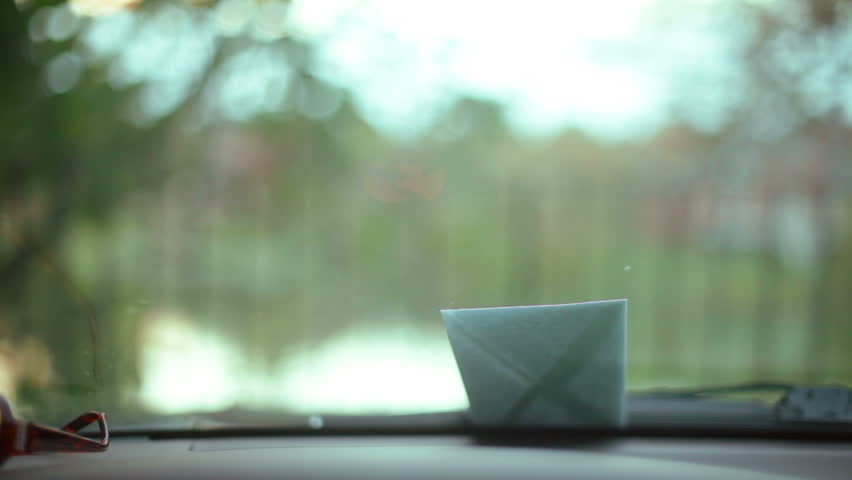 Anonymous note on the wind shield of a car.