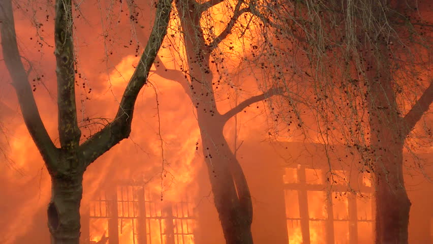 BATTLE GROUND, WASHINGTON - JANUARY 21: Flames consuming the old public high school building during a controlled burn by the local fire department in Battle Ground, Washington on January 21, 2012