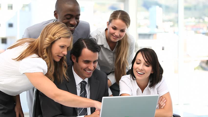Video of a business team looking at a laptop