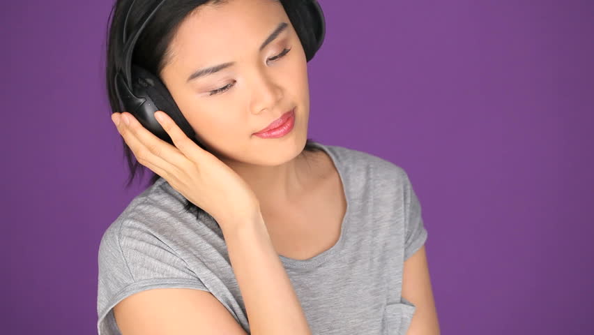 Asian woman listening music