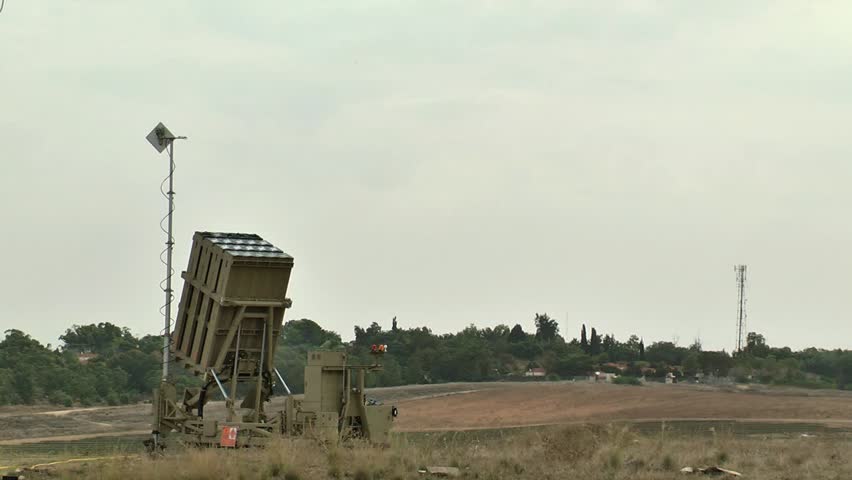 up close shot of an Iron Dome system launches three interceptors. morning, rural area.