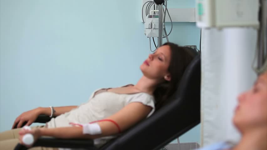 Two patients asleep in hospital ward