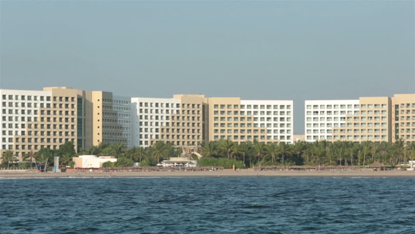 PUERTO VALLARTA, MEXICO - CIRCA NOV 2012:  Mexican Riviera resort hotels along beach viewed from boat circa November 2012 in Puerto Vallarta, Mexico.