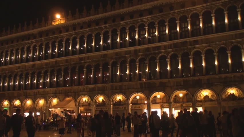 VENICE, ITALY - MAY 11: People are gathered in St Mark's Square in Venice on the evening of May 11, 20012. The square is Venice's largest and one of the world's most famous squares.