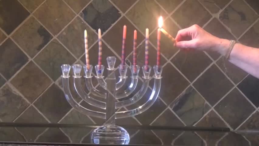 Lighting Hanukkah Candles 6th Night