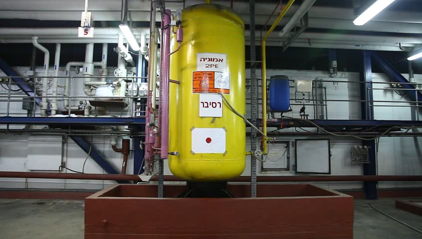 NORTHERN ISRAEL -DECEMBER 17: Firefighters practice to remedy leak accident of corrosive toxic hazardous material Ammonia liquid in seven food factories using protective suites, Northern Israel December 17 2012