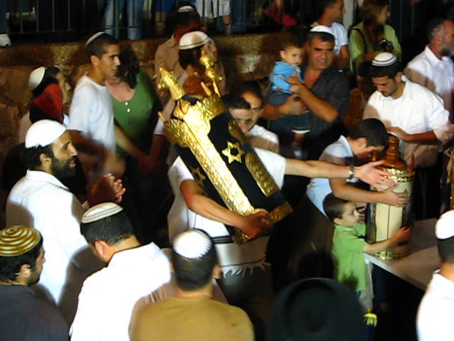 TIVON, ISRAEL â CIRCA 2008: Men dance with Bible scrolls during the ceremony of Hakafot Suchot Simchas Torah, lit. 'Rejoicing with/of the Torah' Tivon, Israel Circa 2008