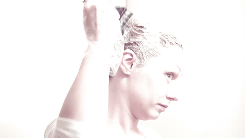 Sony FS-100 - Young woman doing her hair with dye! High key! Bright light on purpose! 

