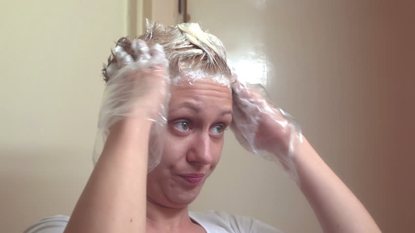 Sony FS-100 - Young woman doing her hair with dye! High key! Bright light on purpose! 