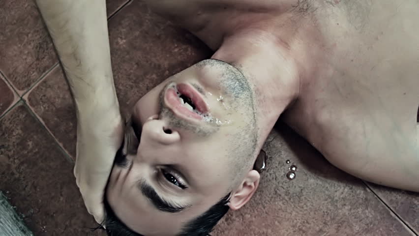 Drunk man on the floor vomiting 