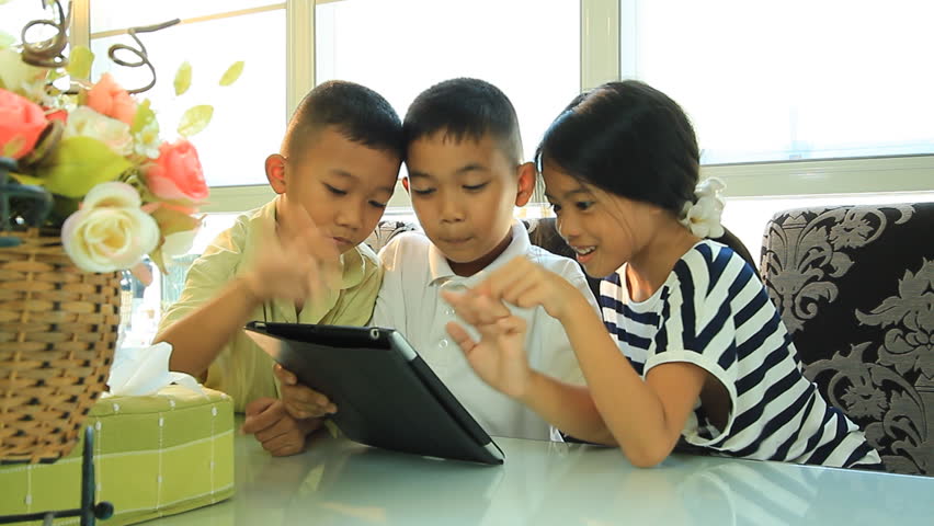 Boys and girls. With a portable computer in the house.