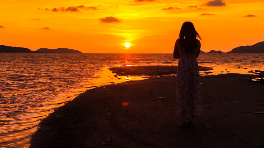 Sea girl/Woman watching sunset at sea