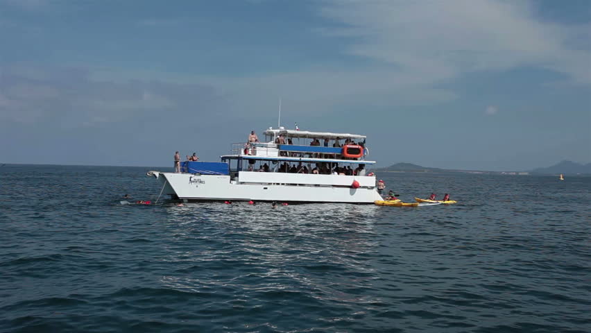 PUERTO VALLARTA, MEXICO NOV 2012: International economy and drug war ease vacation and business travel increase to Mexican riviera resorts. Party boat scuba snorkle swimming Mexico Pacific Ocean. 