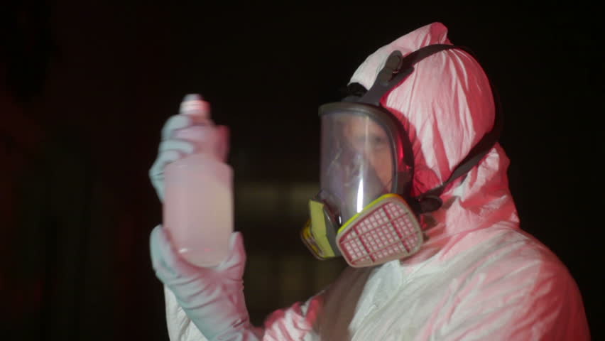 hazmat scientist looking at a chemical solution