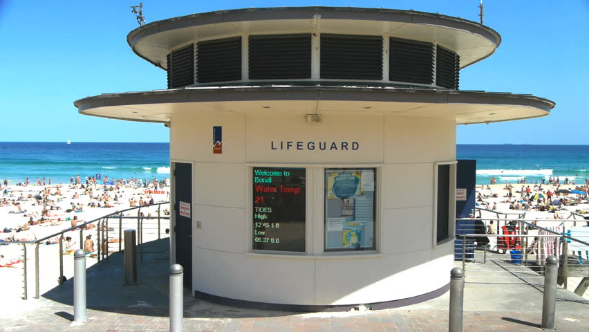 SYDNEY, AUSTRALIA - JAN 3: Bondi beach lifeguard tower on a busy summer day during the peak season in Sydney, Australia on January 3, 2013.