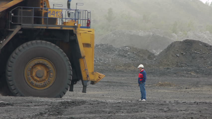 Mining dump trucks in the open pit mine, heavy truck in coal mine