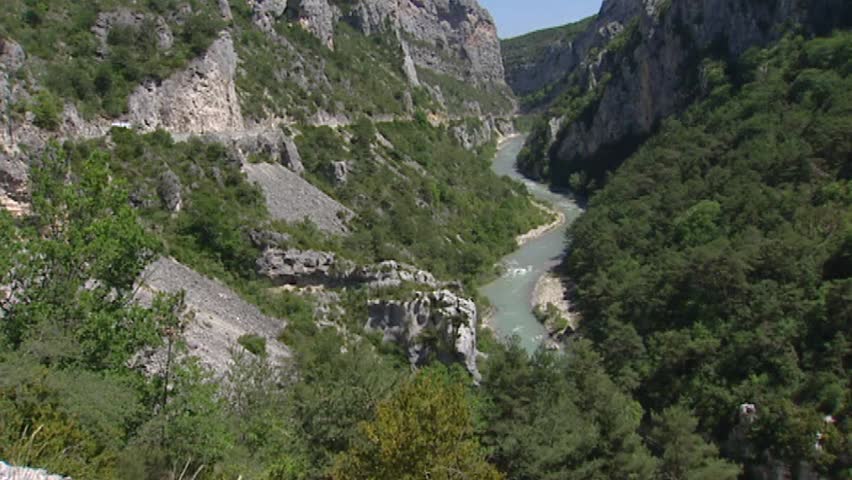 VERDON GORGE, FRANCE: Verdon river in canyon, tilt up + pan lr valley + mountain slopes