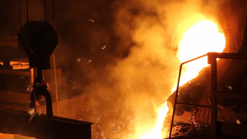 Liquid metal in the foundry, melting iron in furnace