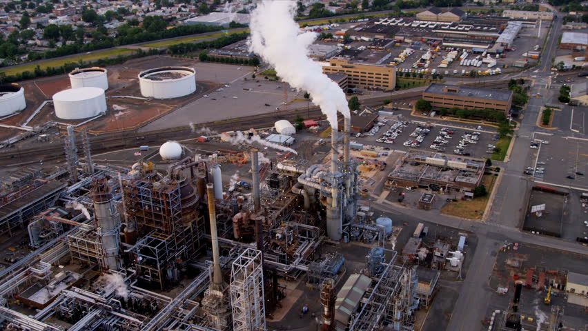 Aerial view of storage tanks and Industrial refinery producing supplying oil and gas, North America