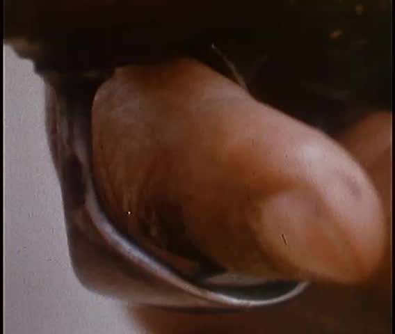 Close-up of finger pulling trigger to set off cave explosion