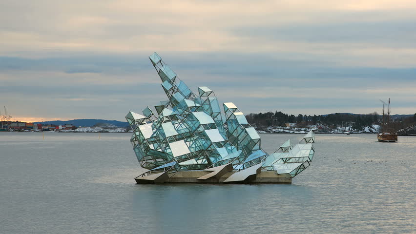 OSLO NORWAY JAN 2013: Art Sculpture - She Lies - is made of stainless steel and glass panels. Permanent installation floating on water. The sculpture turns on its axis in line with the tide and wind