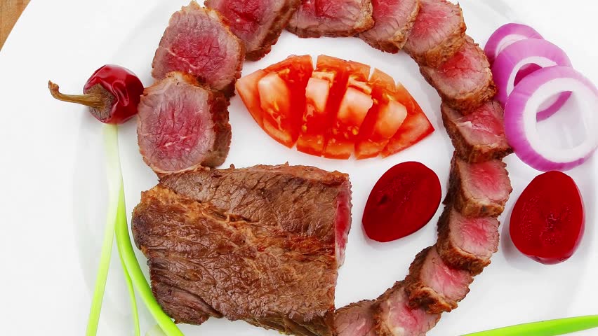 meat savory : roasted bbq meat served on white plate with tomatoes sprouts and bread slow motion hidef