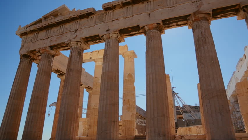 ATHENS, GREECE 2012 Low angle pan of the columns of the Acropolis and Parthenon on the hilltop in Athens, Greece.
