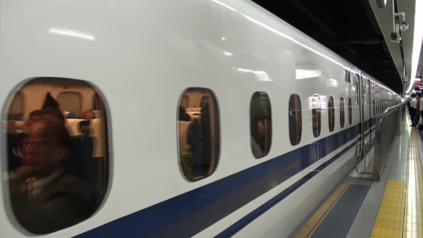 TOKYO, JAPAN - 16 OCTOBER 2012: Bullet train (Shinkansen) rolls into Tokyo station
