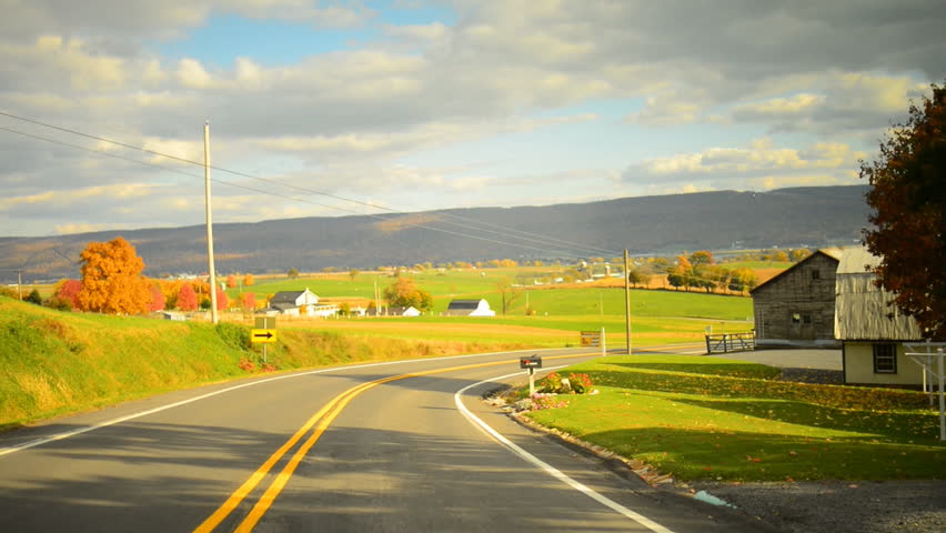 Time lapse of a drive through a hilly twisty road during glorious fall in rural Pennsylvania. 