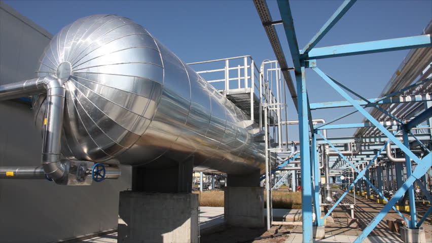 Underground storage of natural gas. Factory distribution, and industrial processing of natural gas with Worker. Many pipelines and construction. 