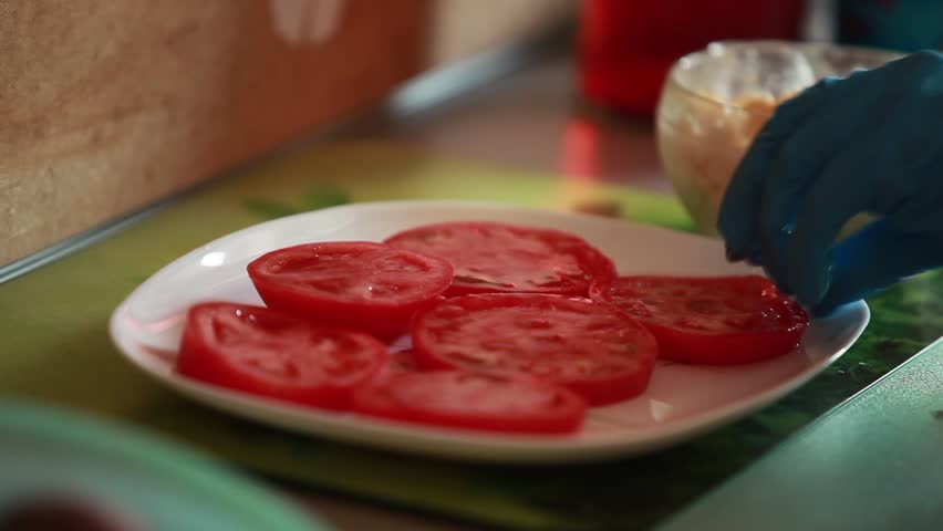 snack with tomatoes grated cheese, garlic and greens