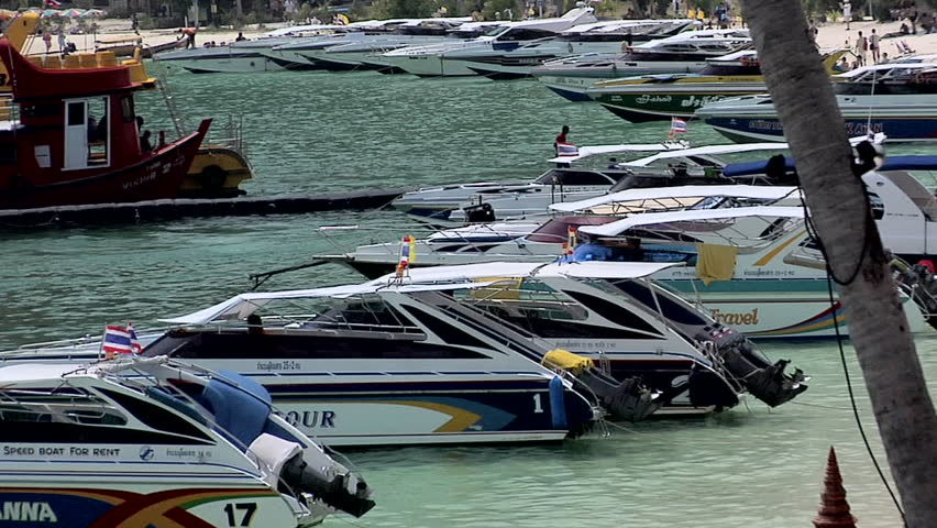 PHI PHI ISLAND, THAILAND - CIRCA FEBRUARY 2009: Motor Boats on Ao Loh Da Lam Beach