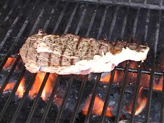 a person Bar-B-Cue's a steak for Breakfast