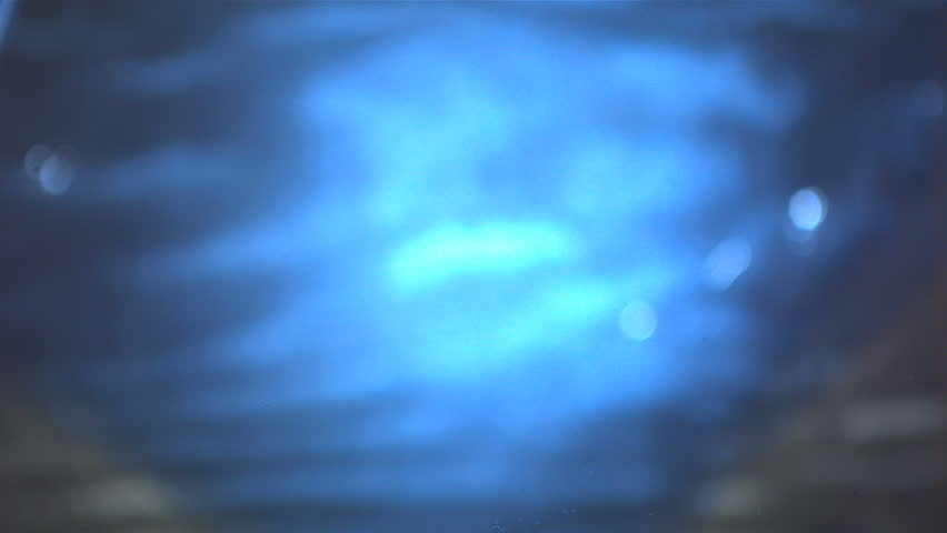 Jalapeno chili pepper falling in water in slow motion
