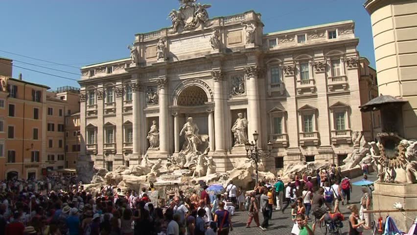 ROME - SEPT 04: Tourists in front of Fontana di Trevi on September 04, 2011 in Rome, Italy. Due to crisis Roman tourism is facing hard times dropping by more than 5% in comparison to 2008.