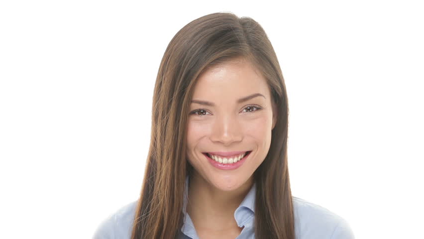Woman smiling closeup portrait. Young business woman professional looking at camera happy. Beautiful multiethnic Asian / Caucasian female model on white background in studio.
