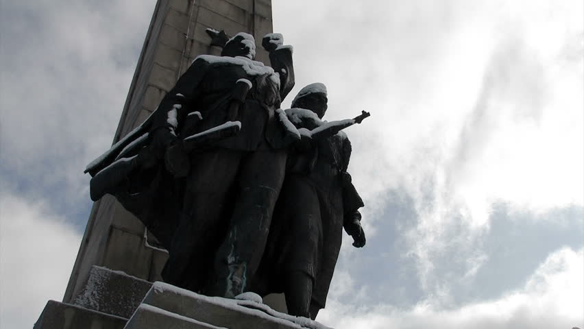 Dolly shot of a freedom monument revealing the communism star.