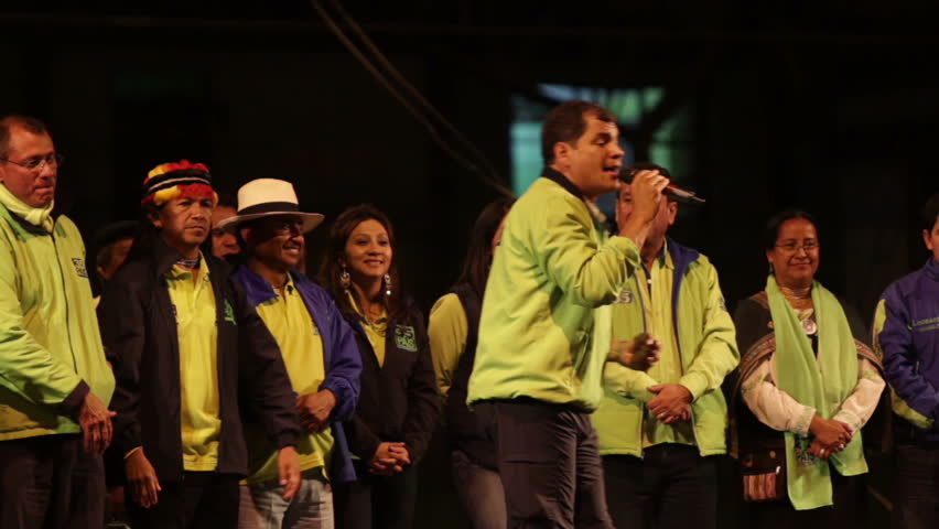 BANOS DE AGUA SANTA, ECUADOR - JANUARY 21: President of Ecuador Rafael Correa singing and dancing to the Alianza Pais anthem during presidential campaign in Tungurahua province, Ecuador on January 21, 2013.